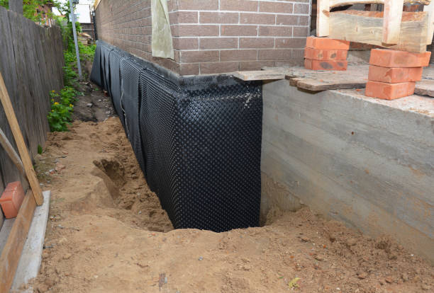 SJ Waterproofing Pros technician performing targeted Waterproofing assessment in Washington, IL